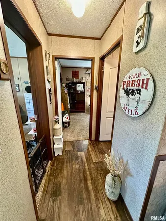 a bathroom with a granite countertop sink a toilet and a mirror