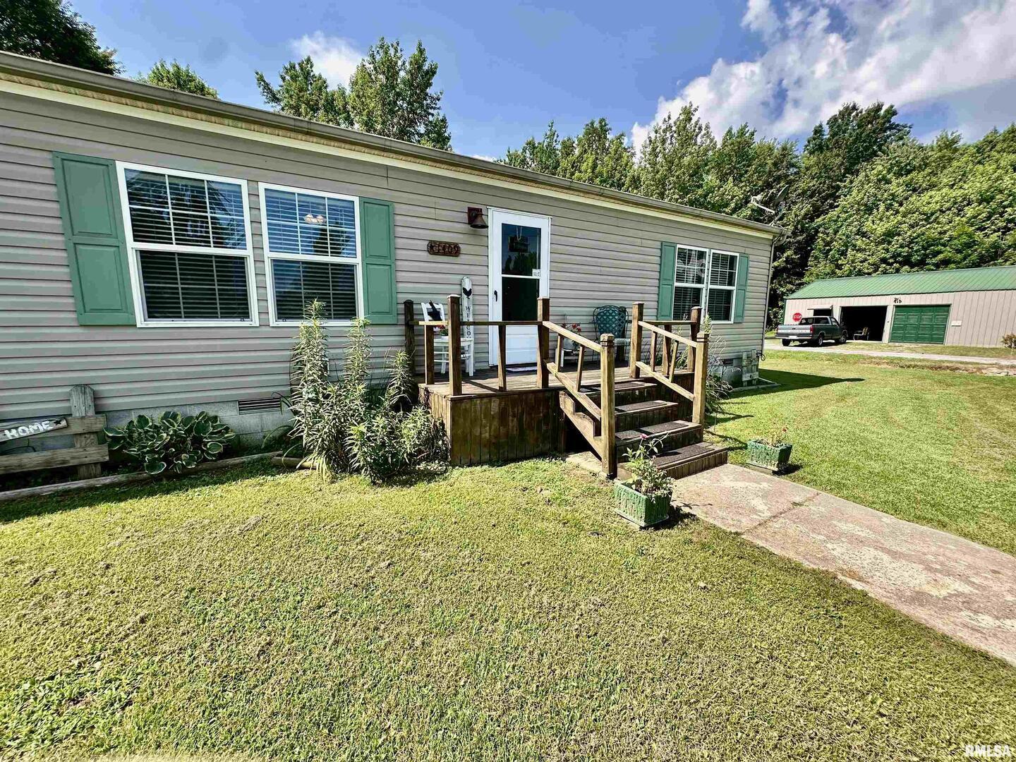 1409 West 5th Street West Frankfort, IL 62896 - Photo 3 of 56 a view of a house with backyard sitting area and garden