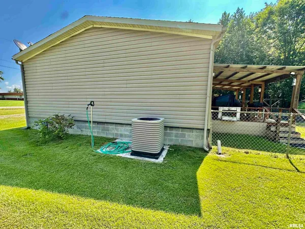 a view of house with swimming pool and porch