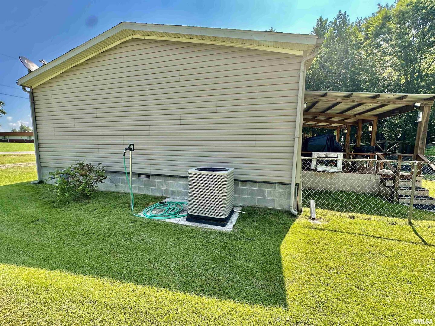 1409 West 5th Street West Frankfort, IL 62896 - Photo 32 of 56 a view of a chair and table in the backyard
