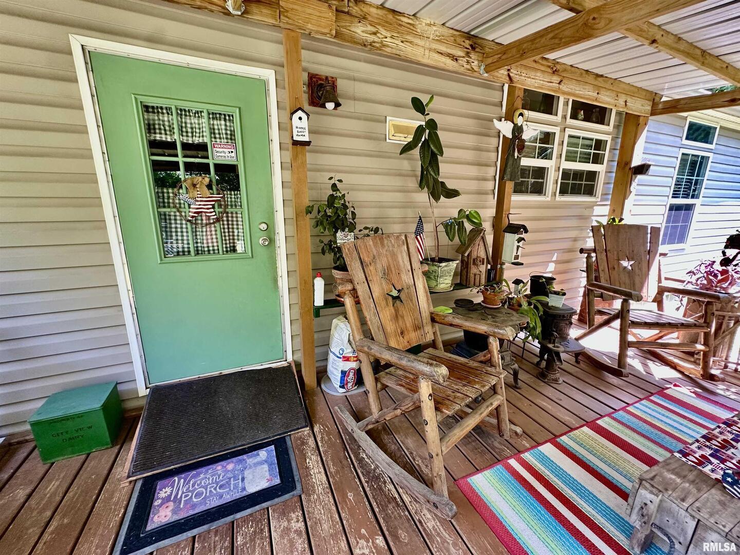 1409 West 5th Street West Frankfort, IL 62896 - Photo 35 of 56 a view of a balcony with chairs and wooden floor