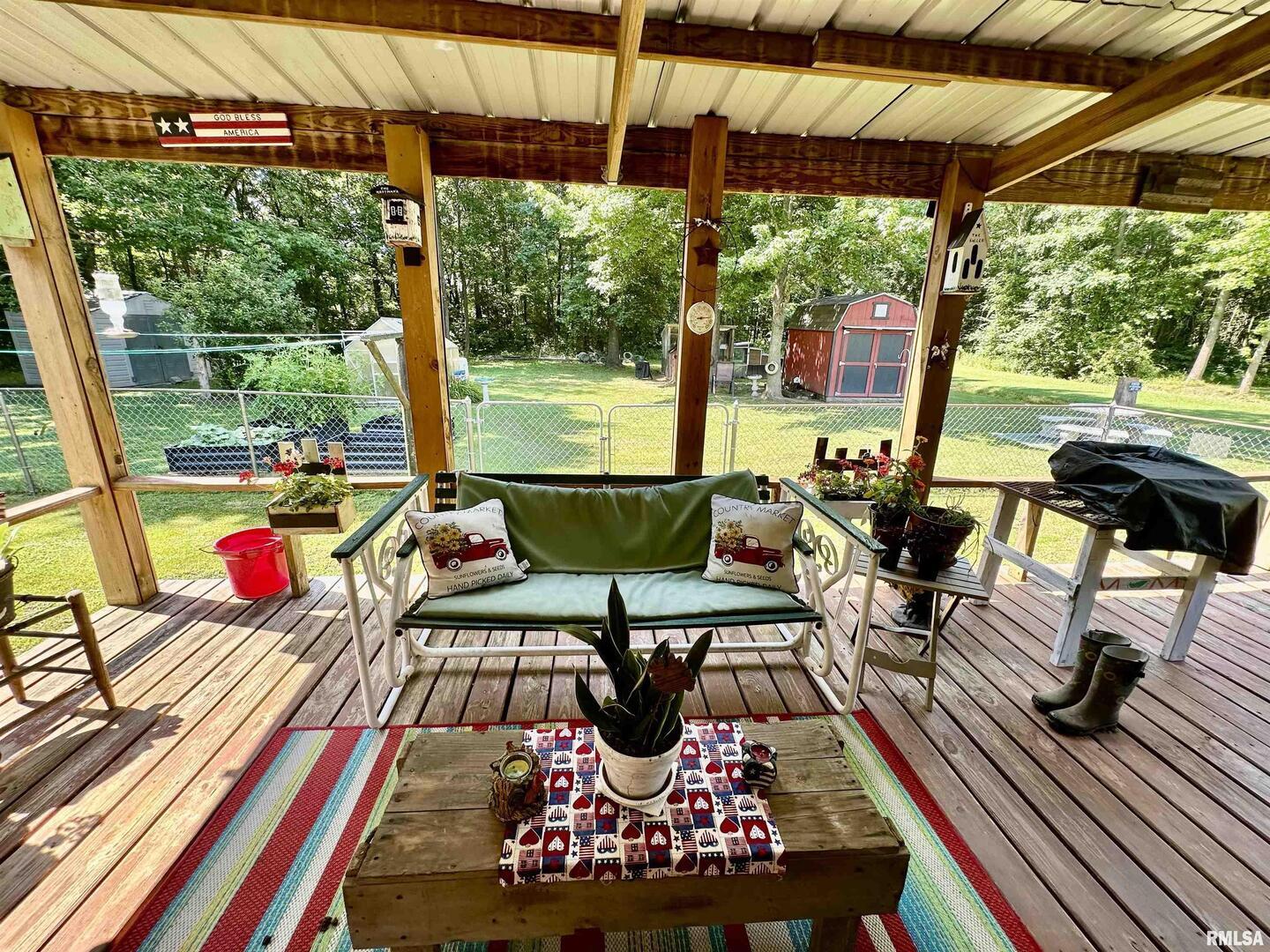 1409 West 5th Street West Frankfort, IL 62896 - Photo 37 of 56 a view of a patio with table and chairs and potted plants