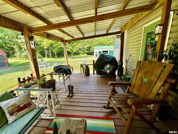 a view of a backyard with swimming pool