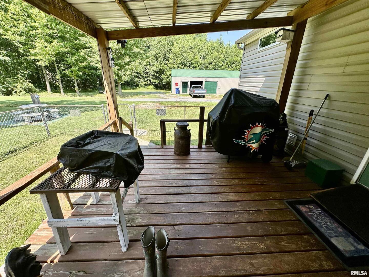 1409 West 5th Street West Frankfort, IL 62896 - Photo 39 of 56 a view of a deck with wooden floor and outdoor seating