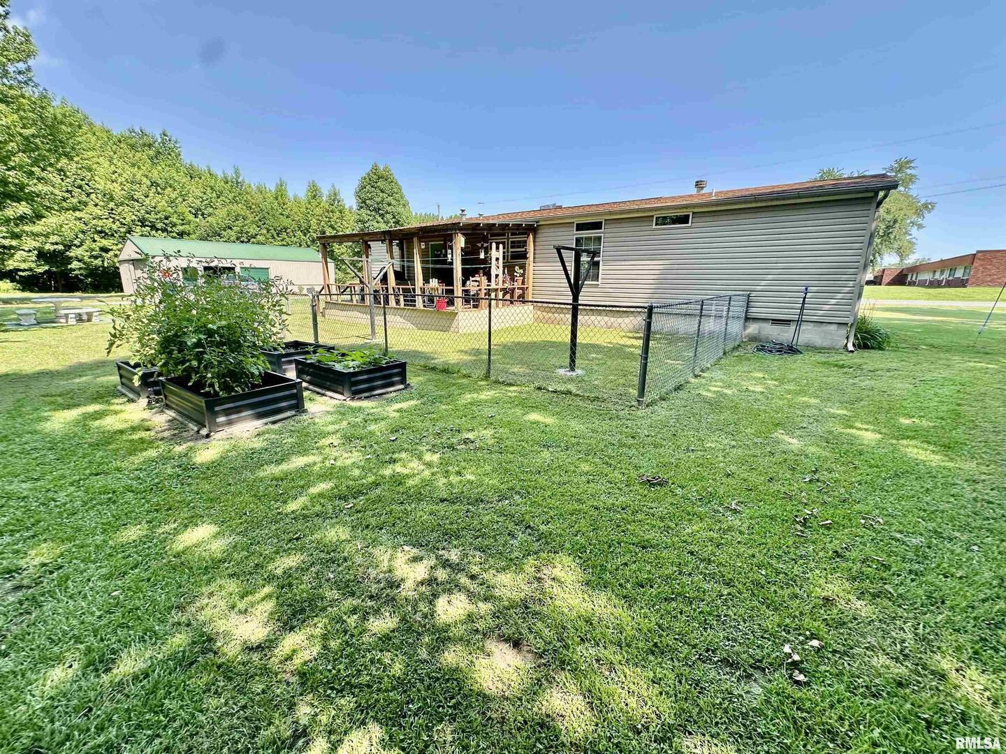 1409 West 5th Street West Frankfort, IL 62896 - Photo 43 of 56 a view of a backyard with plants