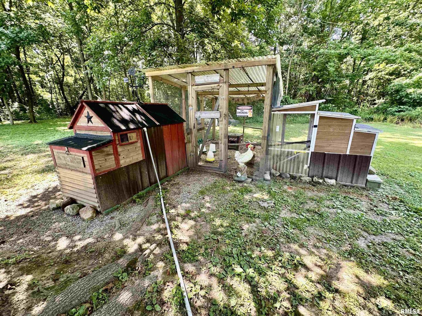 1409 West 5th Street West Frankfort, IL 62896 - Photo 48 of 56 a view of a wooden chairs and table in the backyard