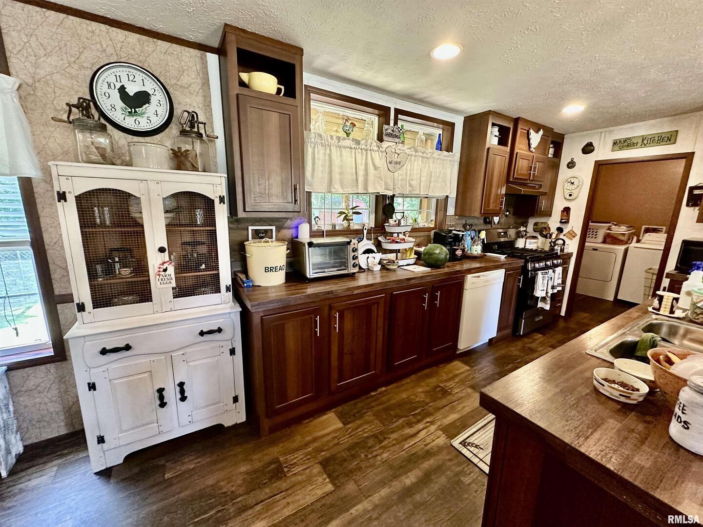 1409 West 5th Street West Frankfort, IL 62896 - Photo 8 of 56 a kitchen with stainless steel appliances granite countertop a stove and a refrigerator