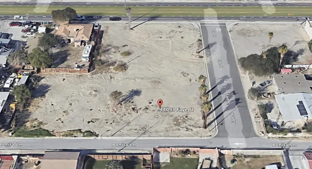 a wall with a sink and a mirror