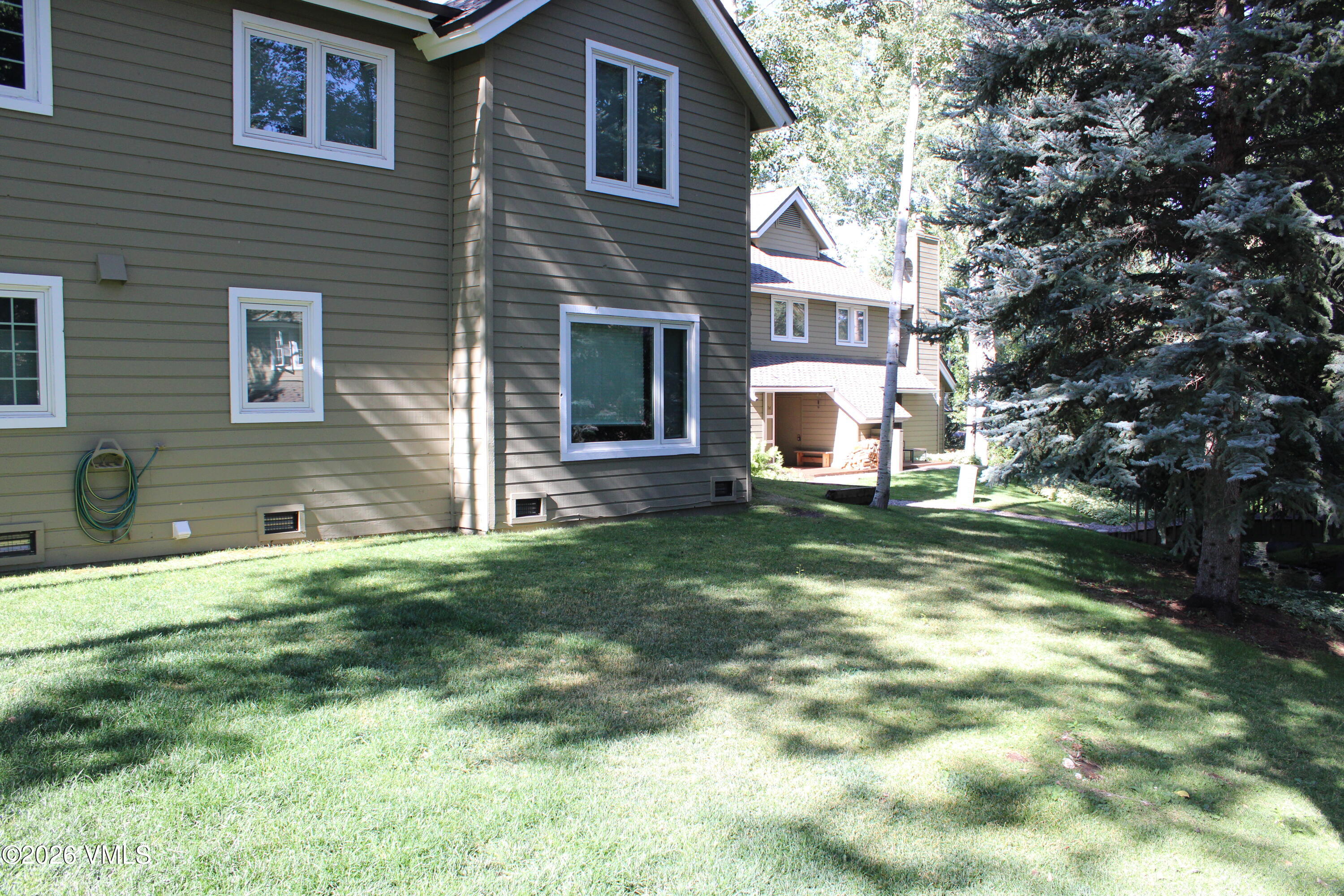 570 Homestead Drive, Unit 41 Edwards, CO 81632 - Photo 19 of 28 a view of a house with backyard and sitting area