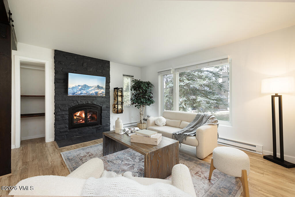 570 Homestead Drive, Unit 41 Edwards, CO 81632 - Photo 2 of 28 a living room with furniture a flat screen tv and a fireplace
