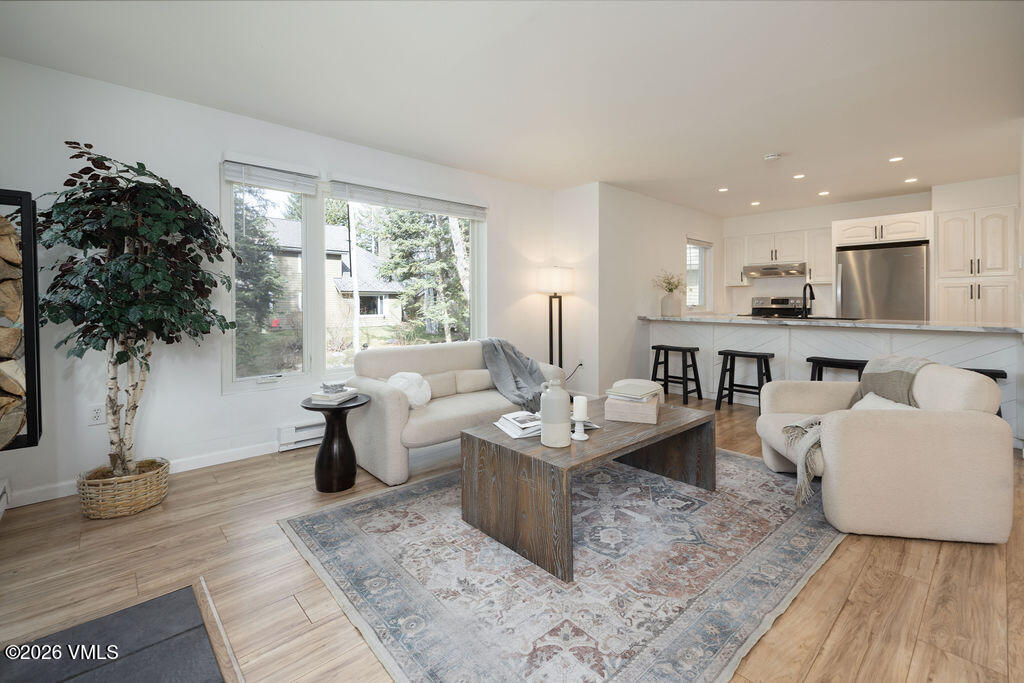 570 Homestead Drive, Unit 41 Edwards, CO 81632 - Photo 3 of 28 a living room with furniture and a large window