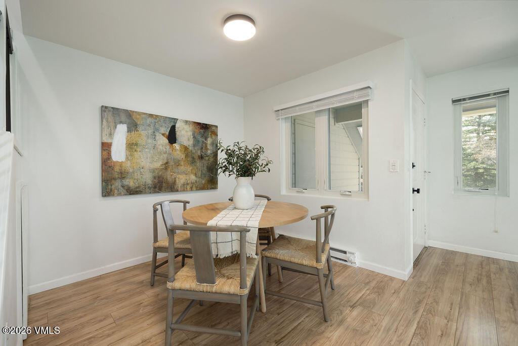 570 Homestead Drive, Unit 41 Edwards, CO 81632 - Photo 5 of 28 a dining room with furniture and wooden floor