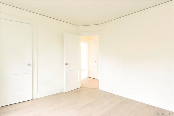 a view of a room with a refrigerator