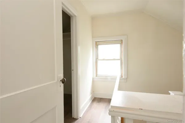 a view of bathroom with bathtub and window