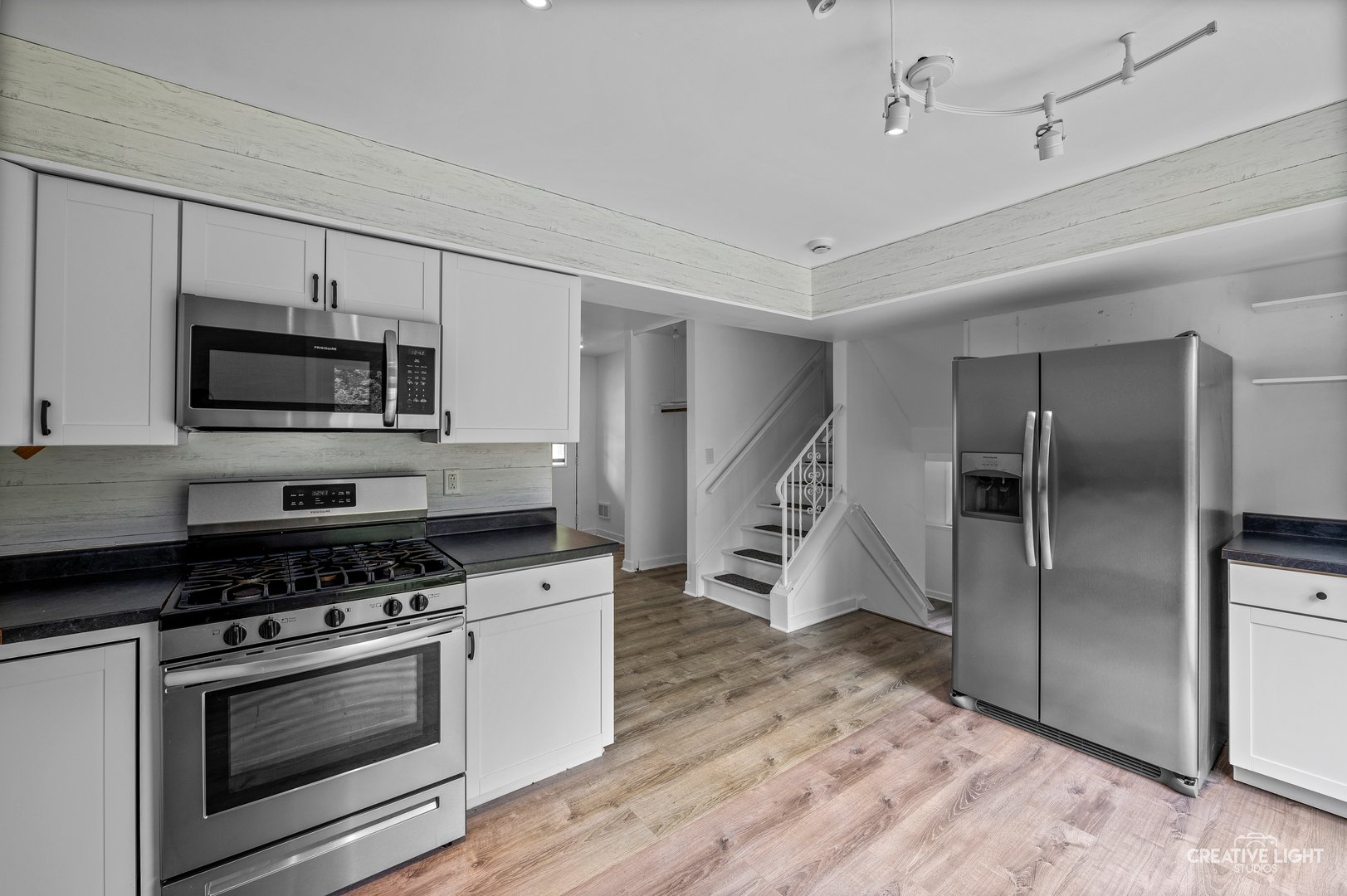 110 Delaware Drive Bolingbrook, IL 60440 - Photo 5 of 15 a kitchen with granite countertop a refrigerator and a stove top oven
