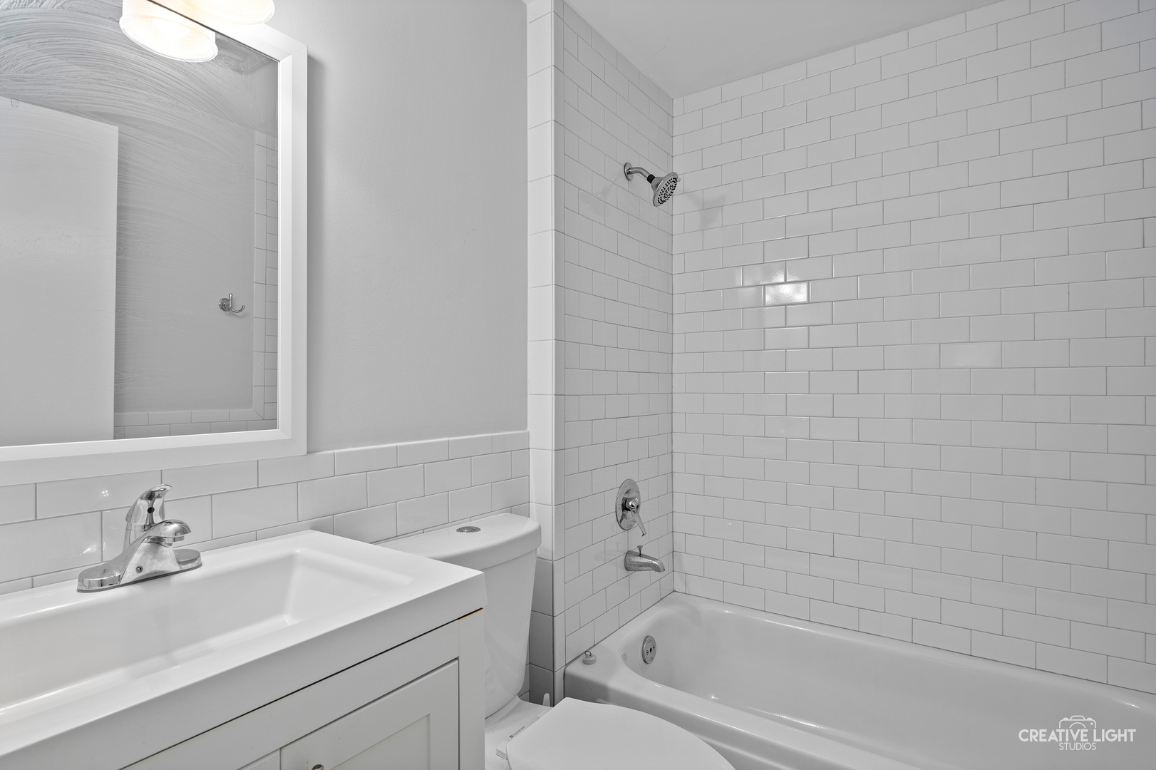 110 Delaware Drive Bolingbrook, IL 60440 - Photo 9 of 15 a bathroom with a bathtub shower sink vanity and toilet