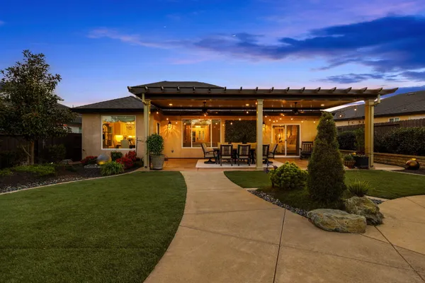 a kitchen with stainless steel appliances a stove a sink and a refrigerator