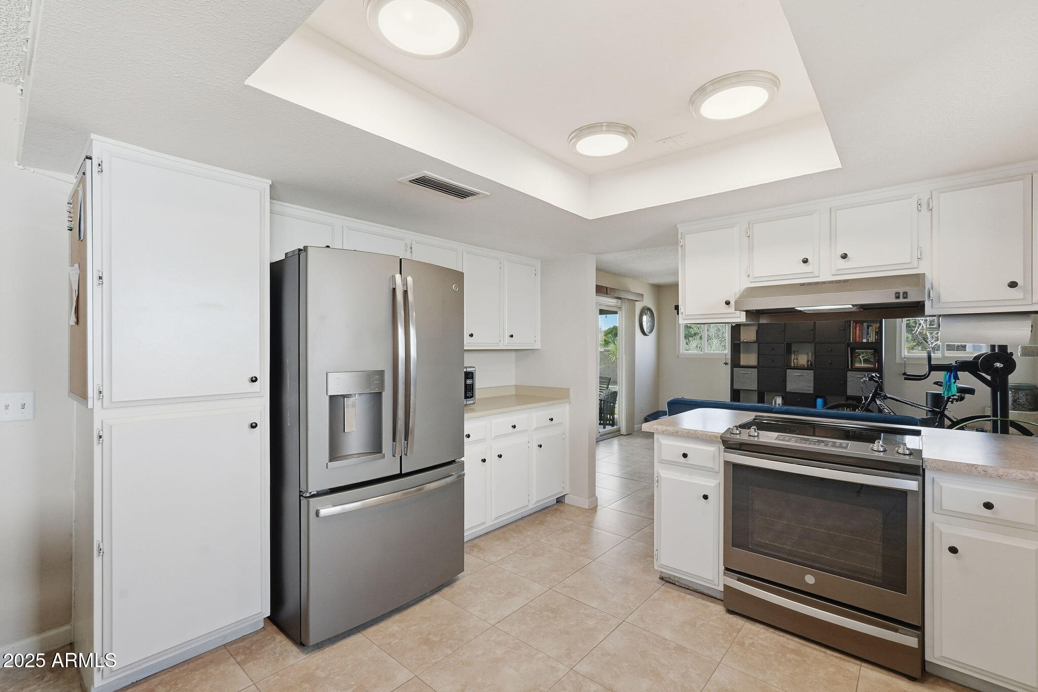 1504 North Iowa Street Chandler, AZ 85225 - Photo 11 of 34 a kitchen with a stove top oven and refrigerator