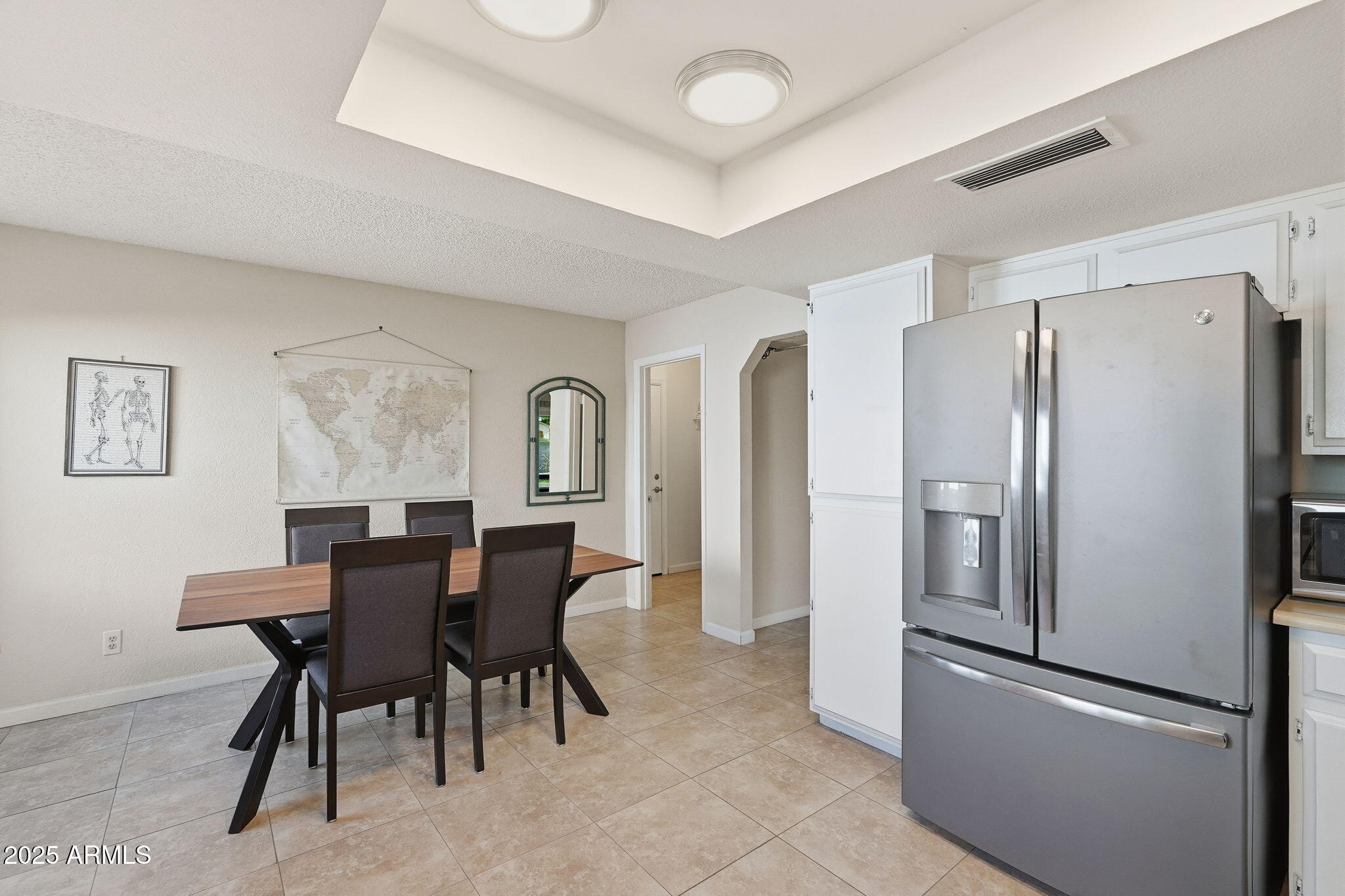 1504 North Iowa Street Chandler, AZ 85225 - Photo 13 of 34 a kitchen with stainless steel appliances granite countertop a refrigerator and a dining table