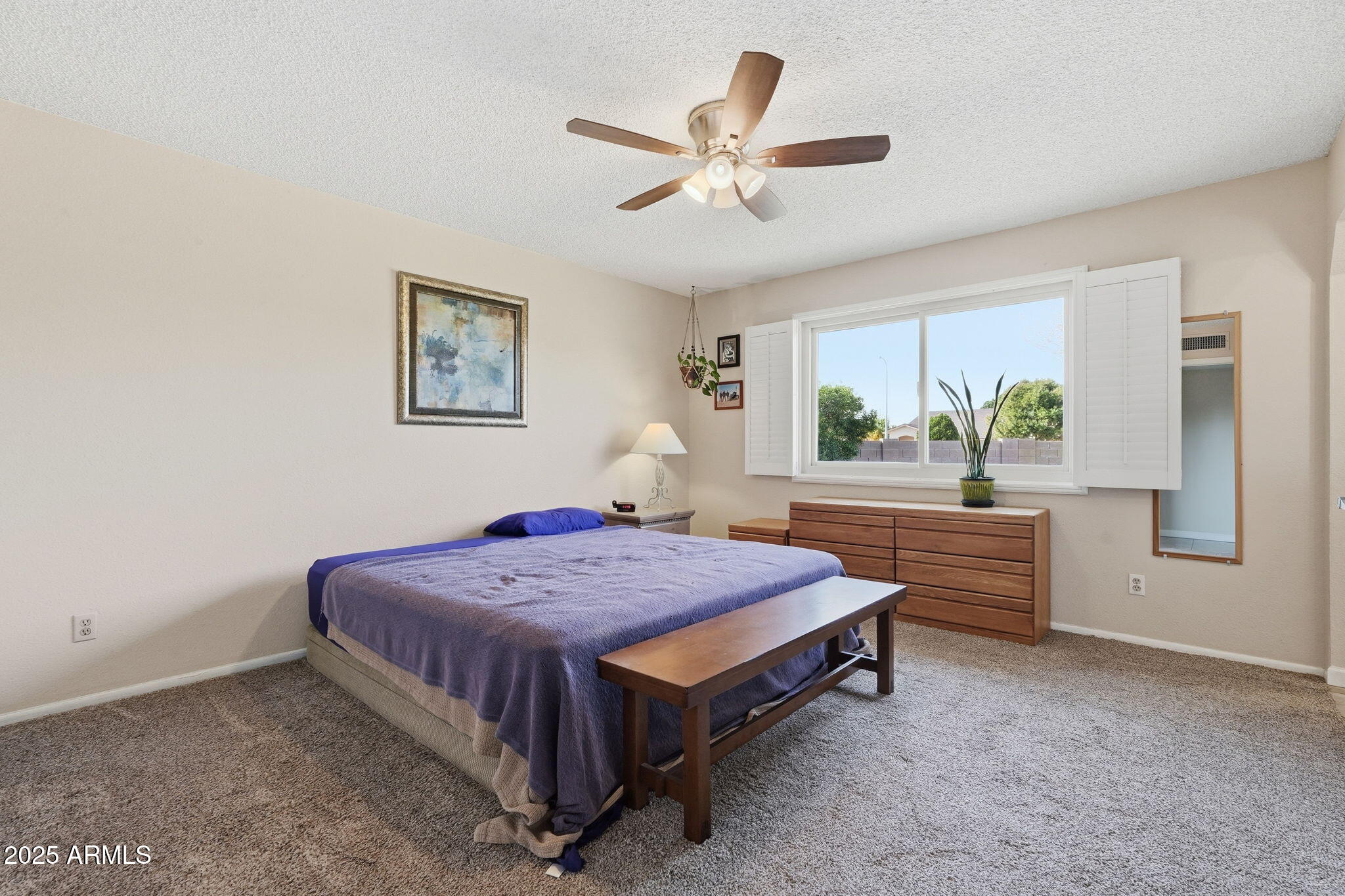 1504 North Iowa Street Chandler, AZ 85225 - Photo 18 of 34 a bedroom with a bed and a chandelier