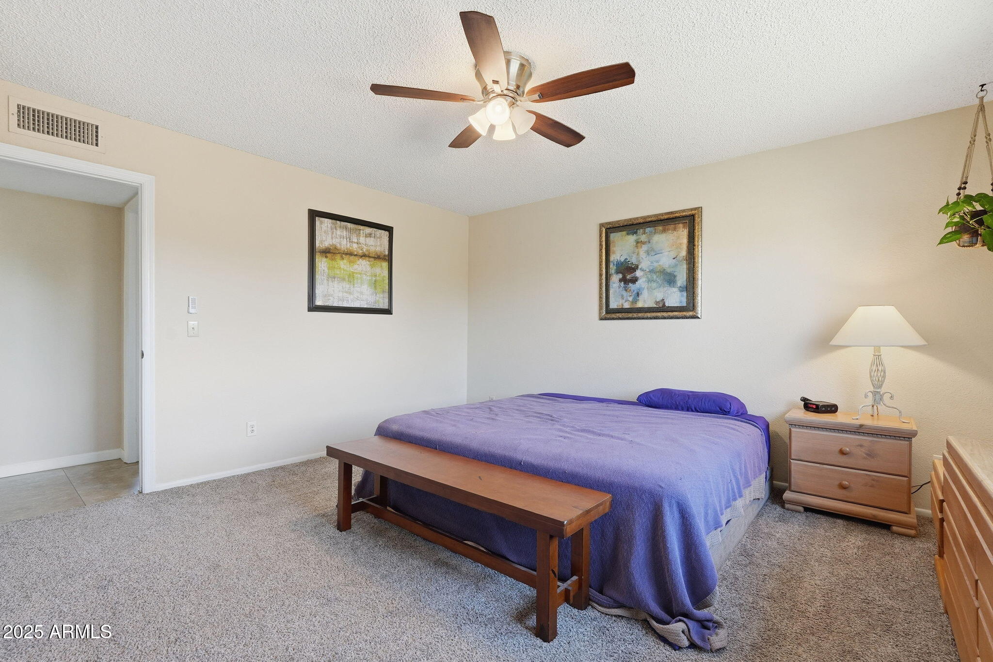 1504 North Iowa Street Chandler, AZ 85225 - Photo 19 of 34 a bedroom with a bed and a chandelier
