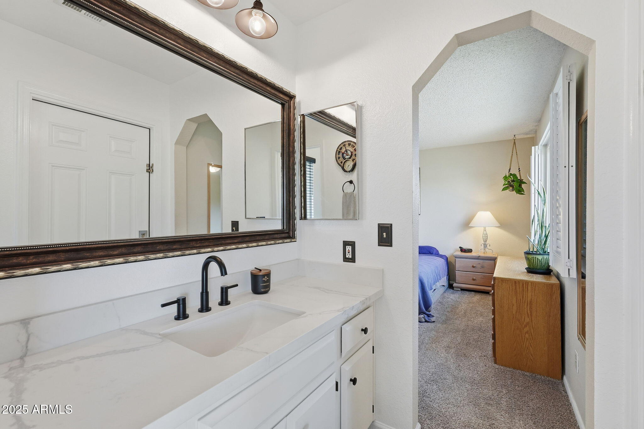 1504 North Iowa Street Chandler, AZ 85225 - Photo 22 of 34 a en suite bathroom with double vanity sinks and a mirror