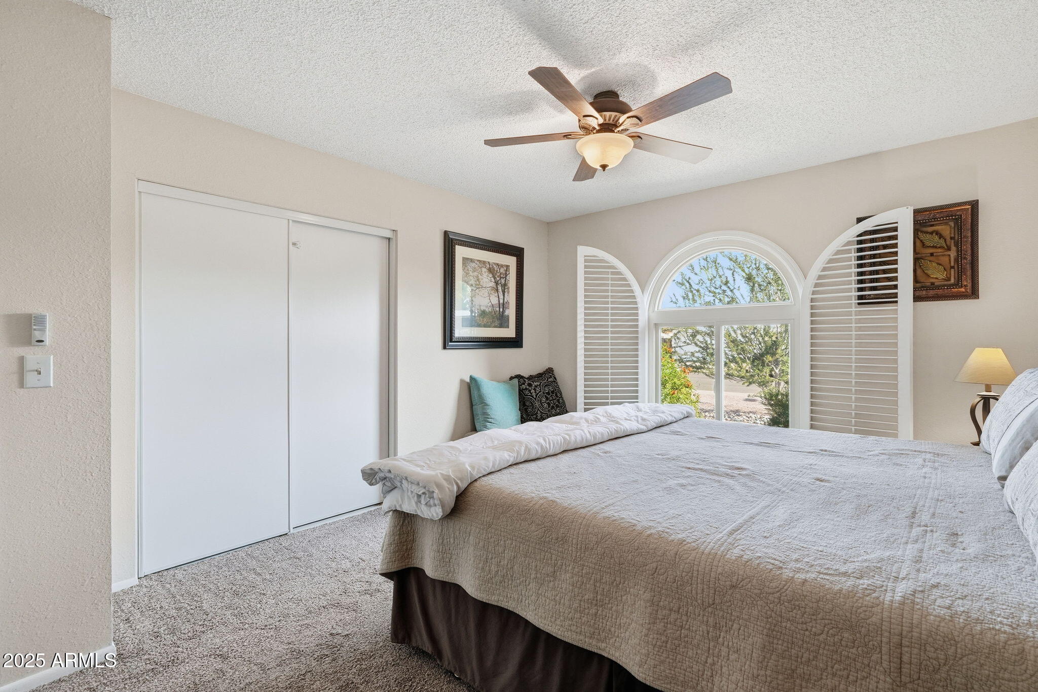 1504 North Iowa Street Chandler, AZ 85225 - Photo 25 of 34 a bedroom with a bed a window and a chandelier
