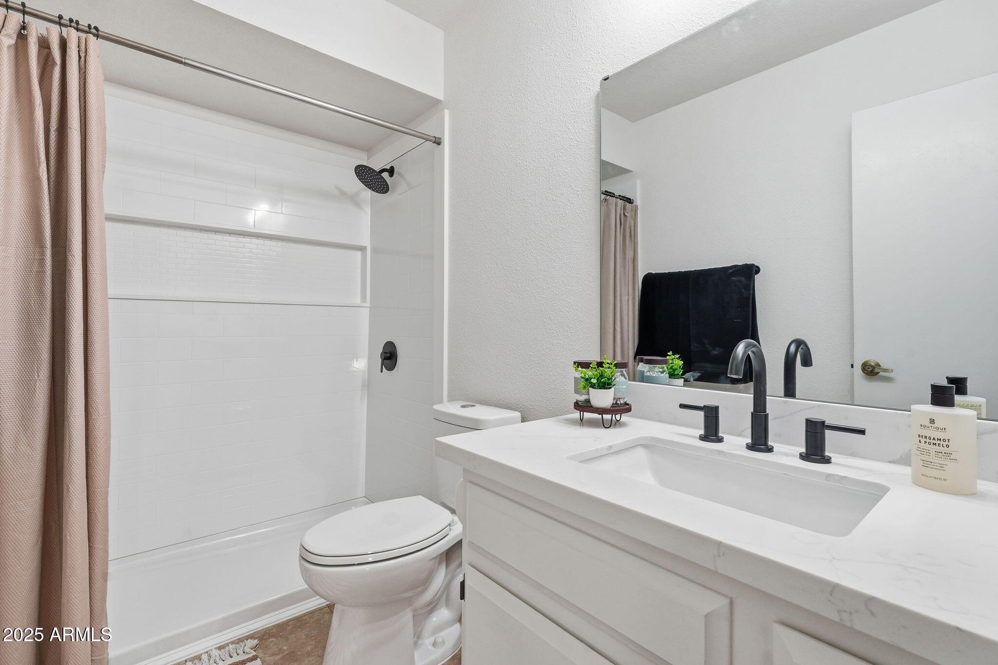 1504 North Iowa Street Chandler, AZ 85225 - Photo 28 of 34 a bathroom with a sink a toilet and shower