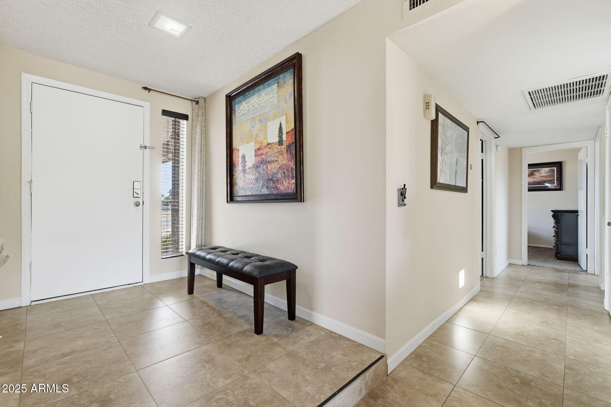 1504 North Iowa Street Chandler, AZ 85225 - Photo 4 of 34 a view of a livingroom with furniture and entryway window