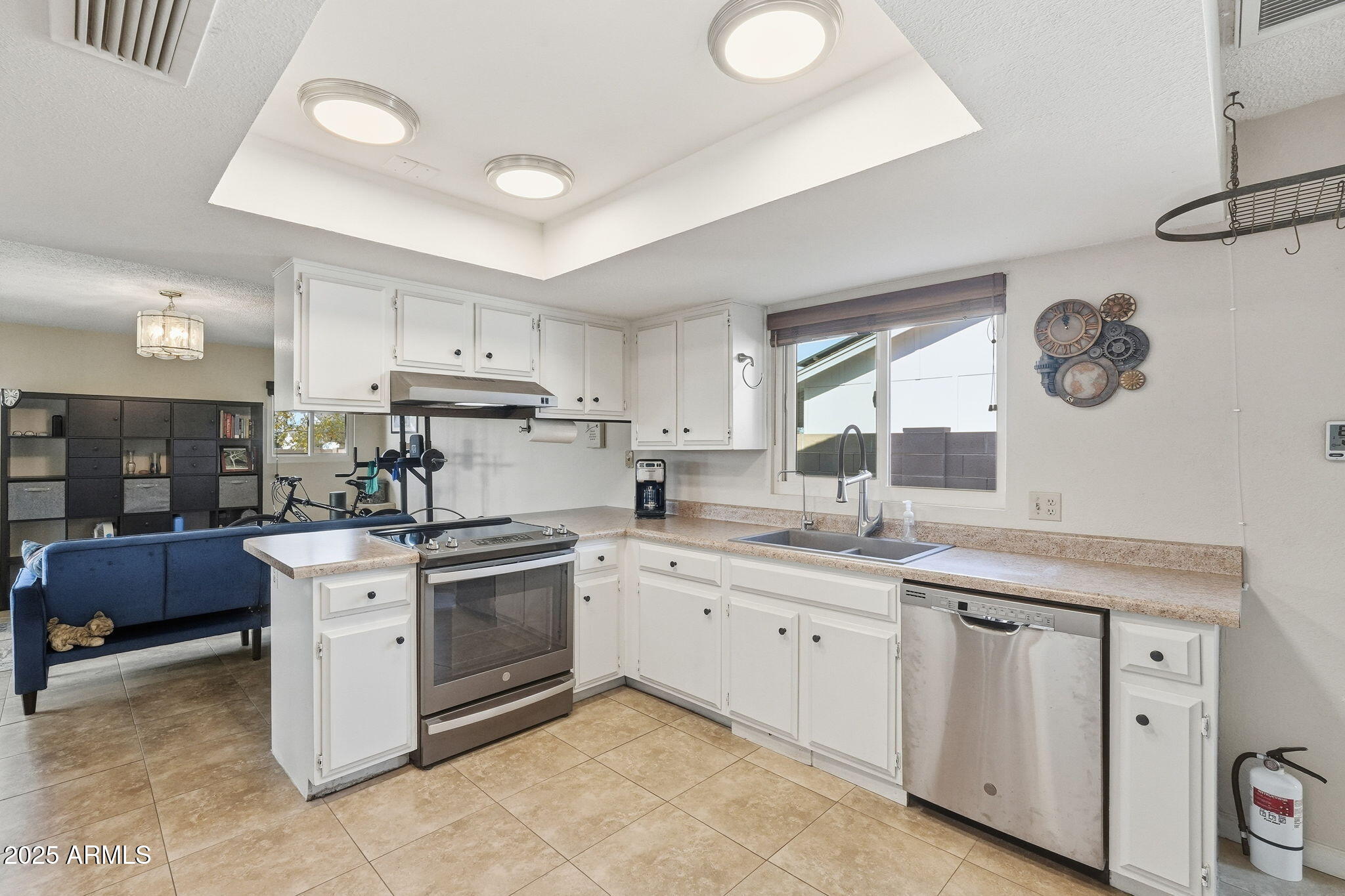 1504 North Iowa Street Chandler, AZ 85225 - Photo 10 of 34 a kitchen with a stove top oven sink and cabinets