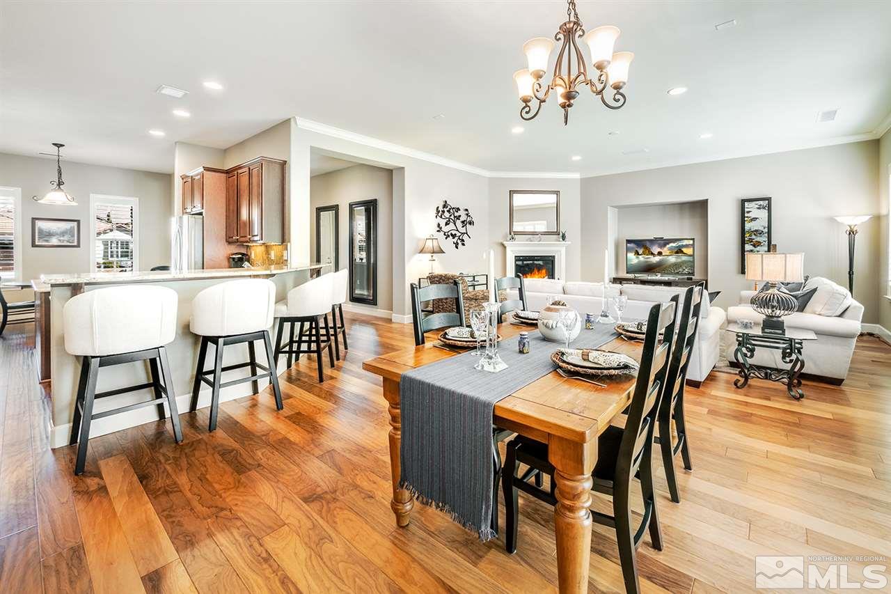 9360 Chalkstone Way Reno, NV 89523 - Photo 5 of 26 a view of a dining room with furniture window and wooden floor