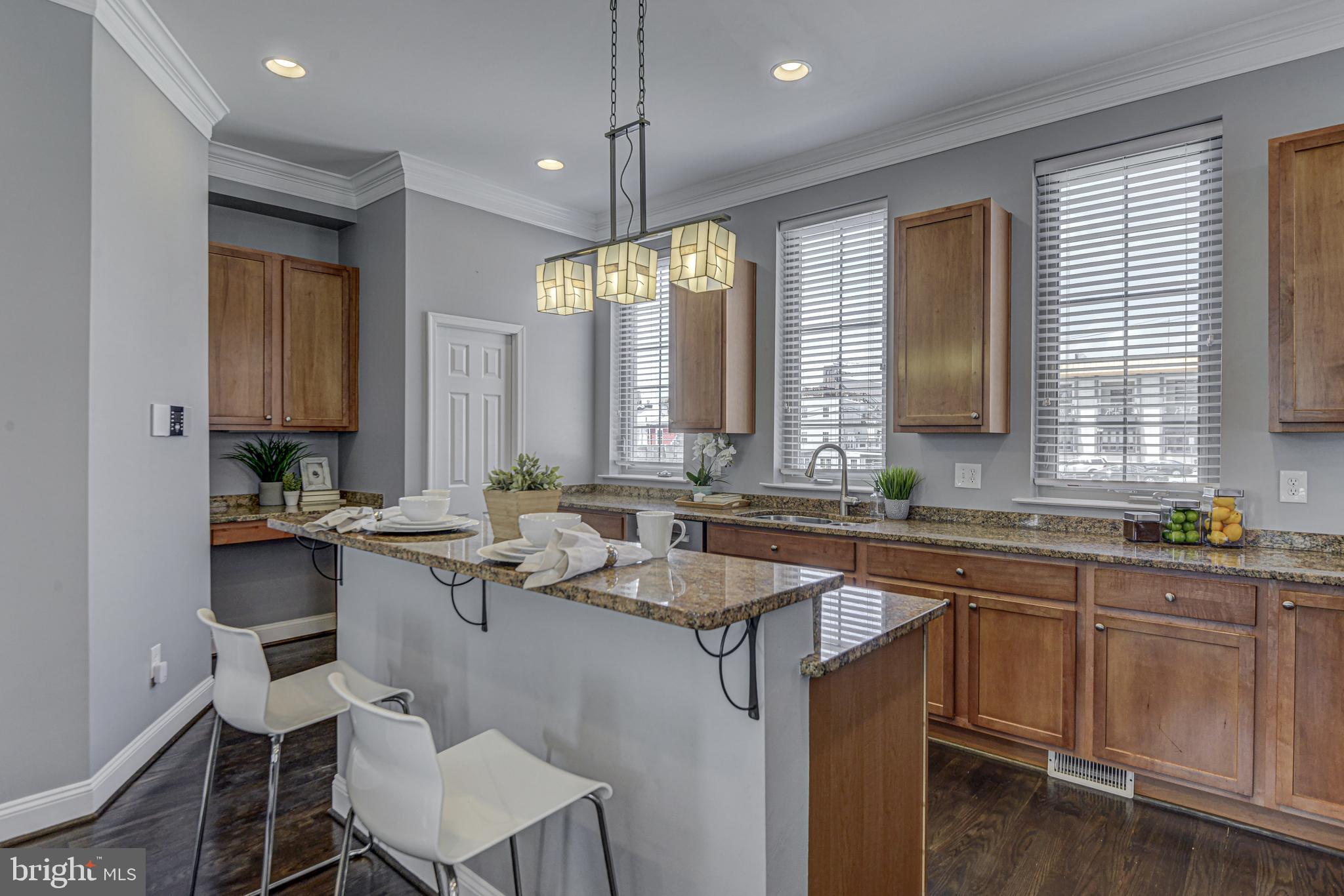 1016 South Conkling Street, Unit A Baltimore, MD 21224 - Photo 20 of 50 Kitchen w/ breakfast bar