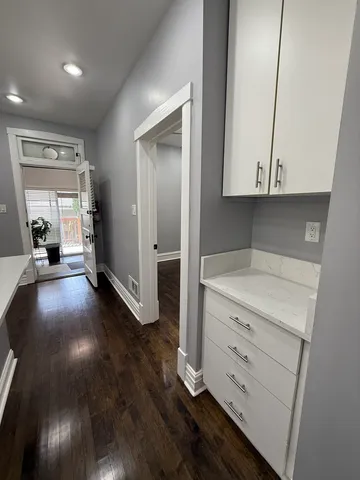 wooden floor in an empty room and a window