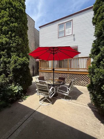 an outdoor space with pool and furniture