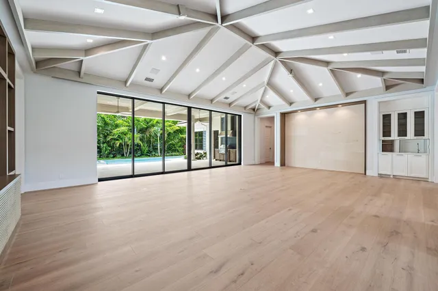 a view of an empty room with a balcony