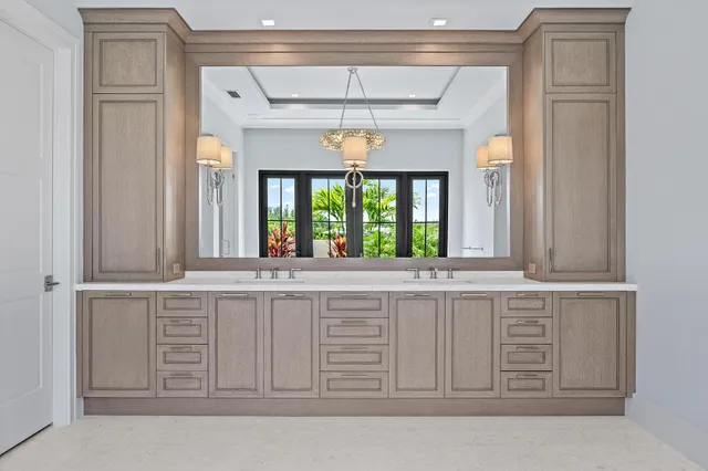 a spacious bathroom with a double vanity sink and a mirror