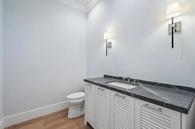 a utility room with sink dryer and washer