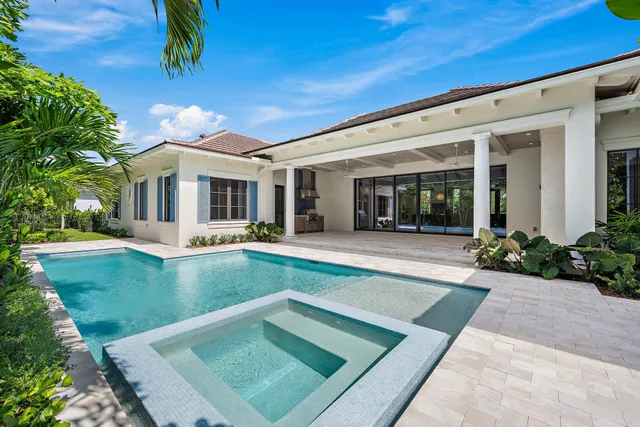 a view of house with swimming pool outdoor seating