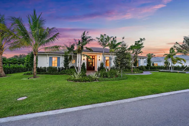 a view of a patio with table and chairs potted plants with wooden floor