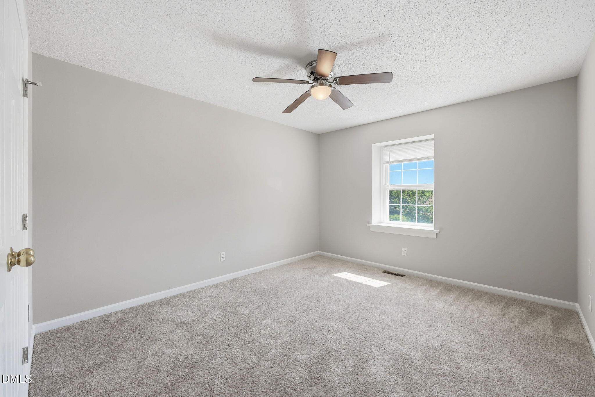 145 Jones Franklin Road, Unit D Raleigh, NC 27606 - Photo 14 of 23 a view of an empty room with a window