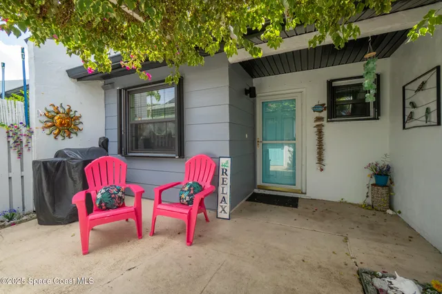 a backyard of a house with seating space