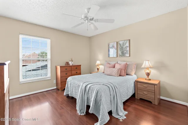 a bedroom with a bed and a lamp