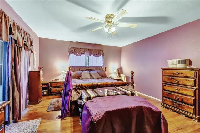 a bedroom with furniture and a window