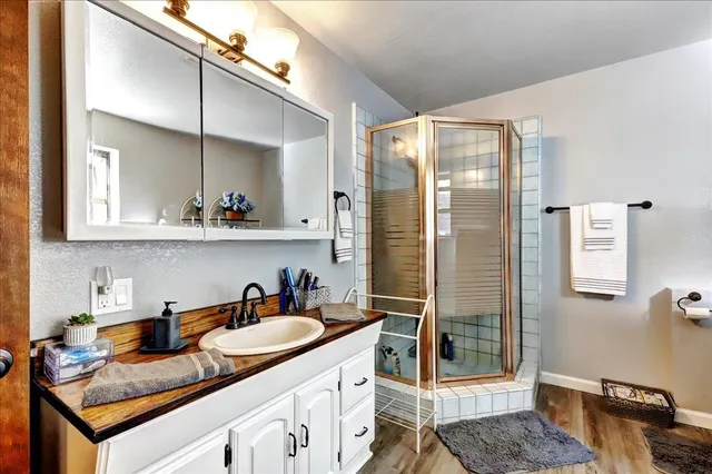 a bathroom with a bathtub and shower