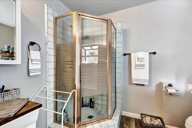 a bathroom with a tub sink and mirror