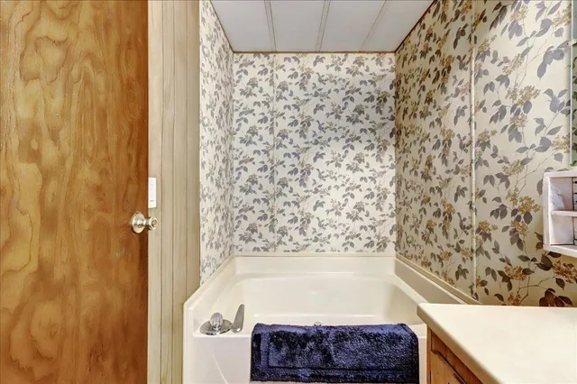 a view of a room with furniture and musical instruments