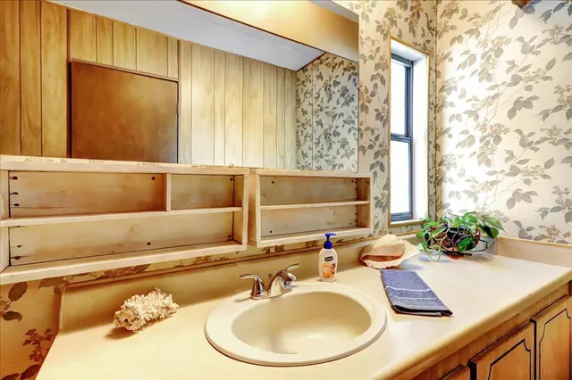 a living room with a couch and a table with chairs