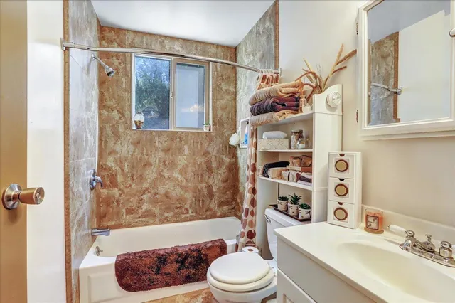 a view of balcony with wooden floor and outdoor seating