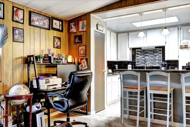 a kitchen with stainless steel appliances a sink stove and refrigerator