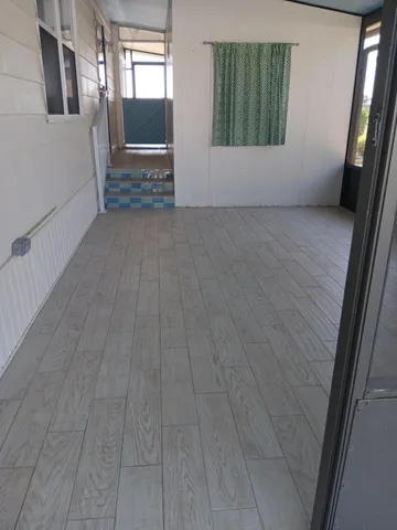 a large white kitchen with a window